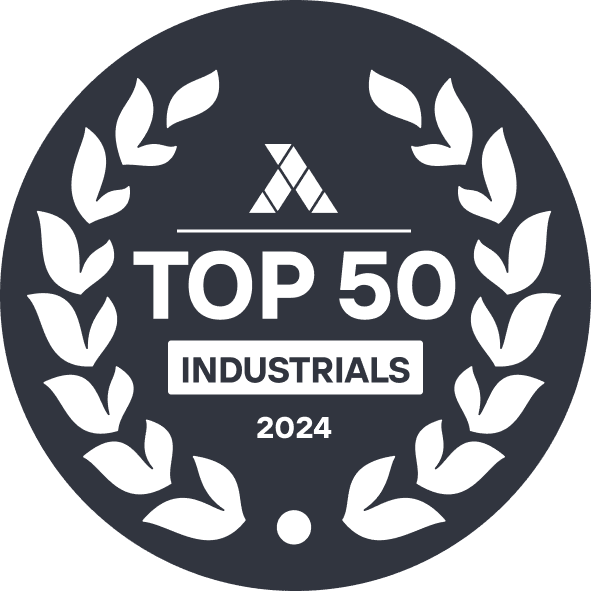 A circular badge with laurel design reads "Top 50 Industrials 2024," featuring a triangular logo above the text, perfect for those looking to sell your business with prestige.