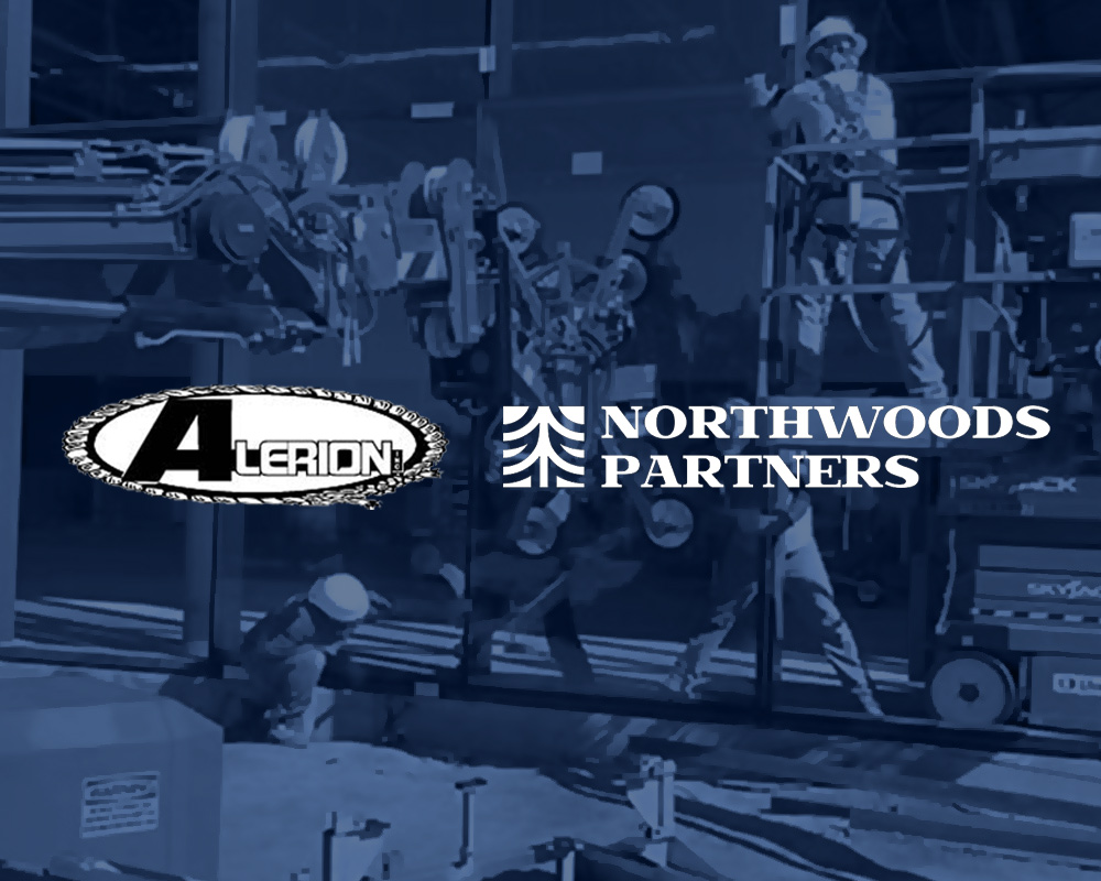 Construction workers install large glass panels on a building exterior. The Alerion Door and Glass and Northwoods Partners logos, highlighting their recent acquisition, are overlaid on the image.